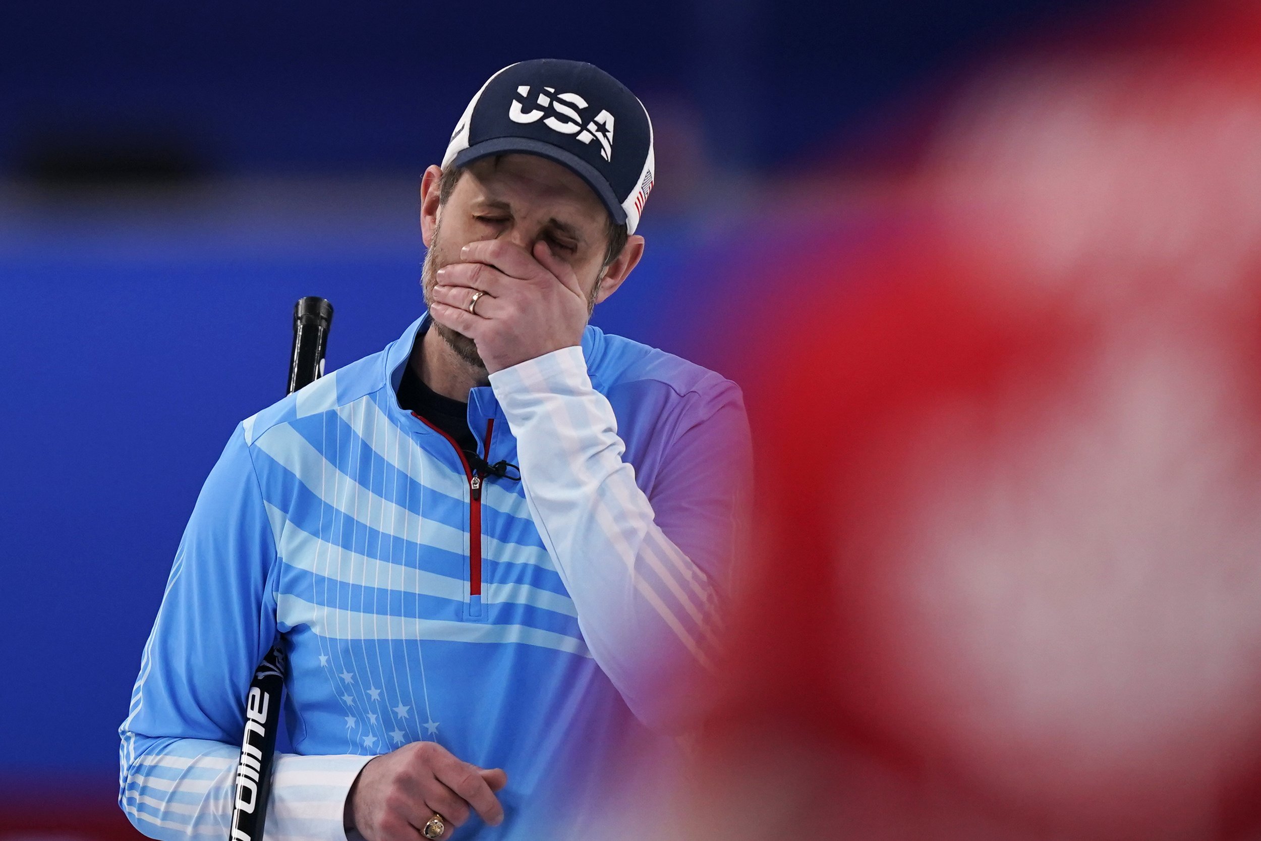  United States' John Shuster reacts after a bad throw during the men's curling bronze medal match between Canada and the United States at the Beijing Winter Olympics Friday, Feb. 18, 2022, in Beijing. (AP Photo/Brynn Anderson) 
