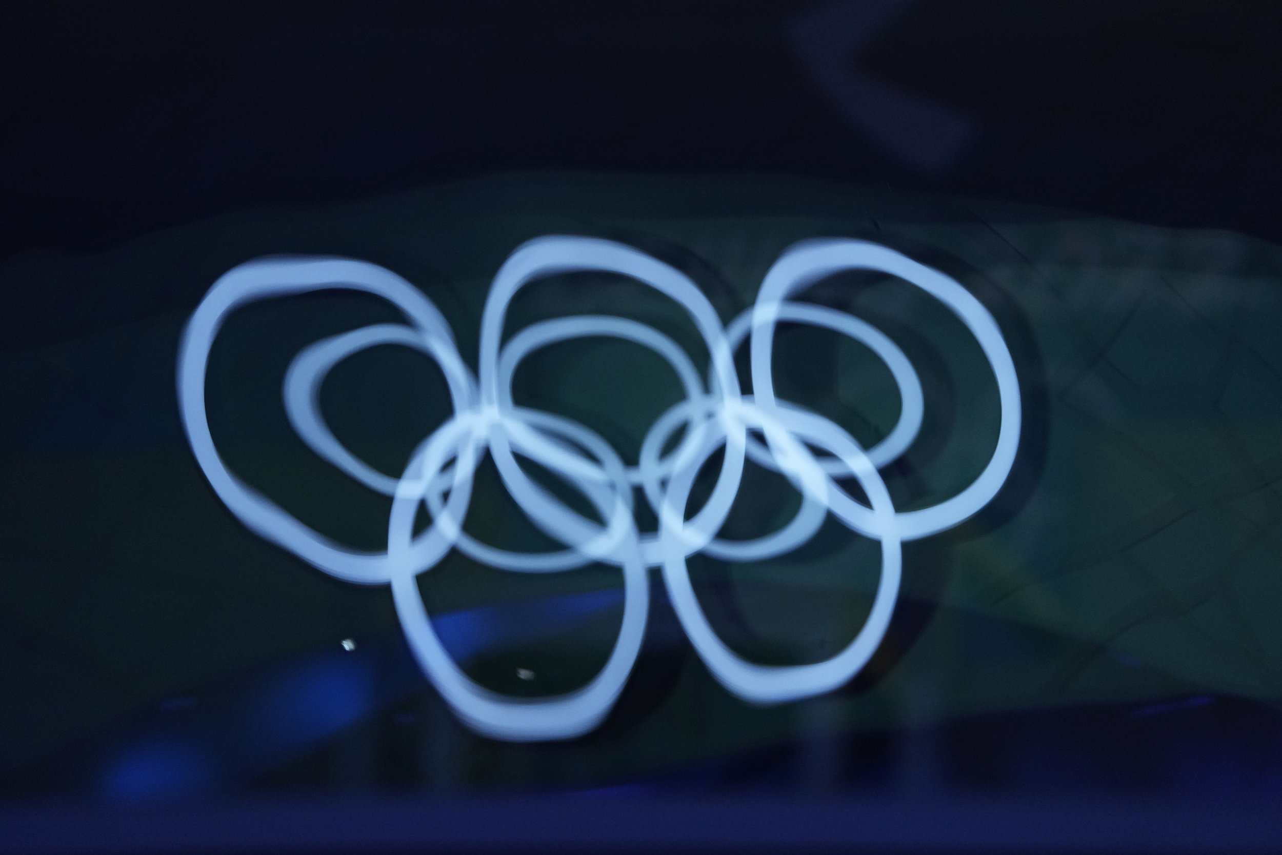  Two Olympic Rings are reflected on a window of a building at the Medals Plaza at the 2022 Winter Olympics, Friday, Feb. 18, 2022 in Beijing. (AP Photo/Jae C. Hong) 