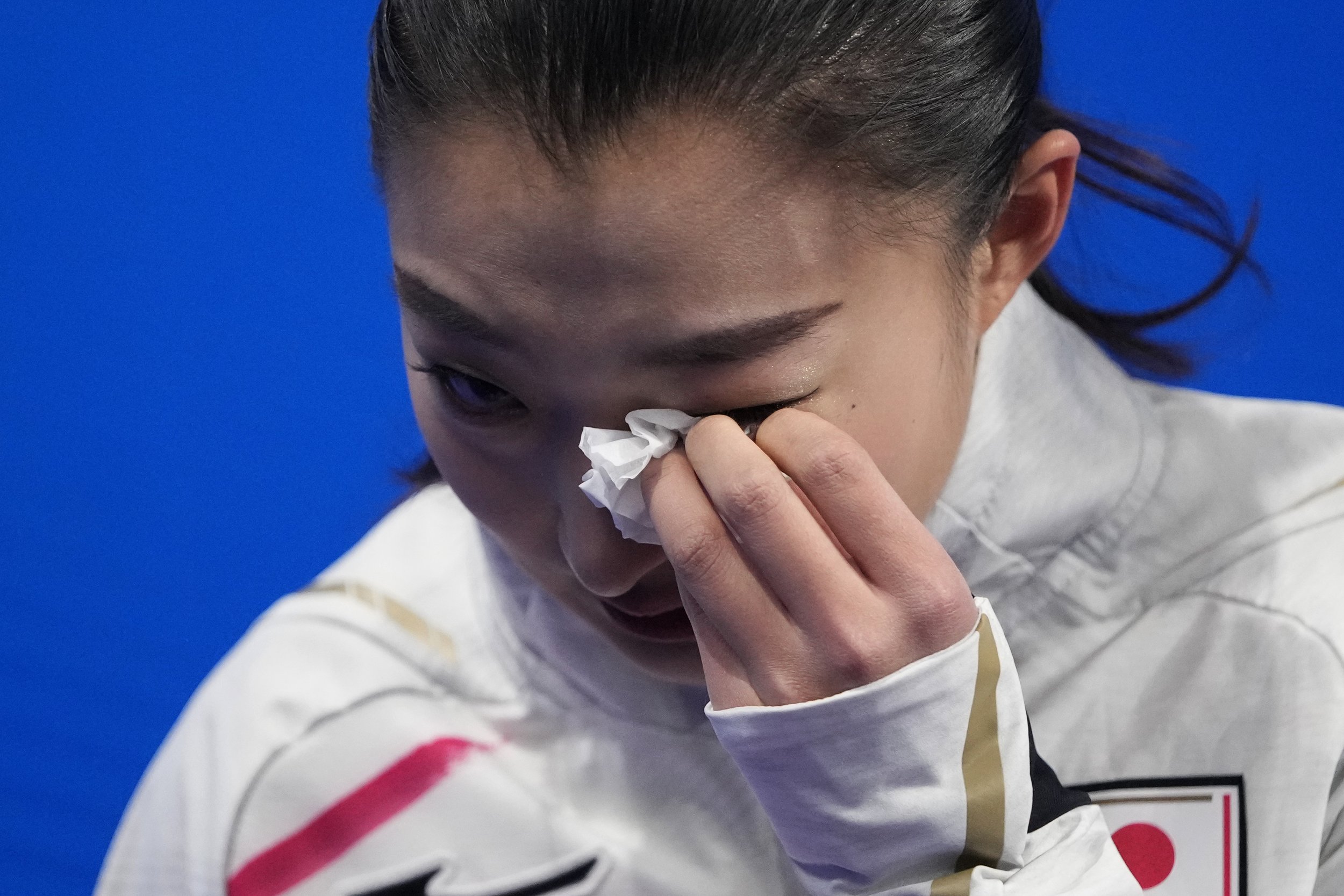  Kaori Sakamoto, of Japan, reacts after the women's short program during the figure skating at the 2022 Winter Olympics, Tuesday, Feb. 15, 2022, in Beijing. (AP Photo/Natacha Pisarenko) 