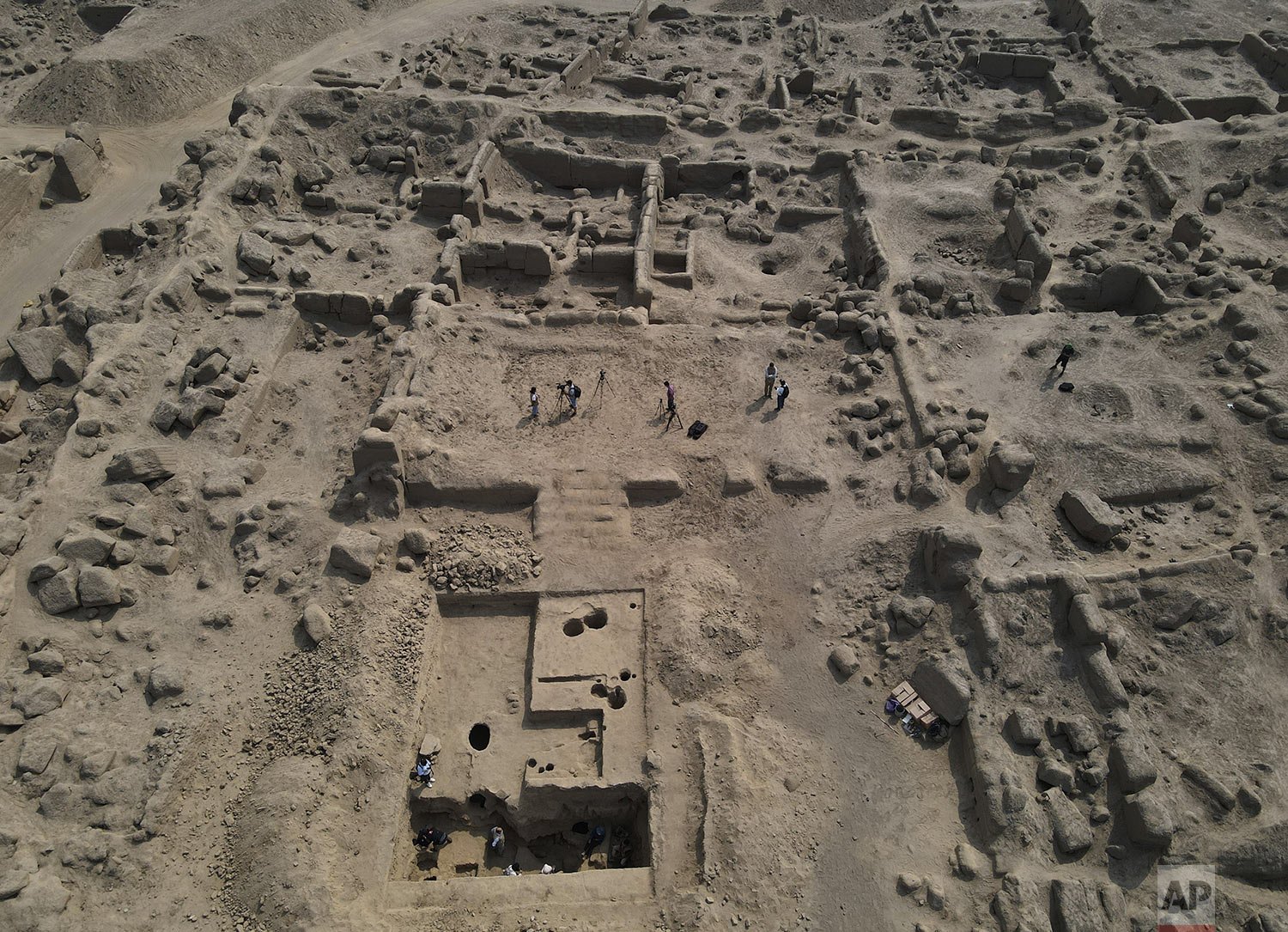  Archaeologists work at the site where six mummies of children from 800-1200 AD were found in Cajamarquilla, near Lima, Peru, Feb. 13, 2022. (AP Photo/Martin Mejia) 