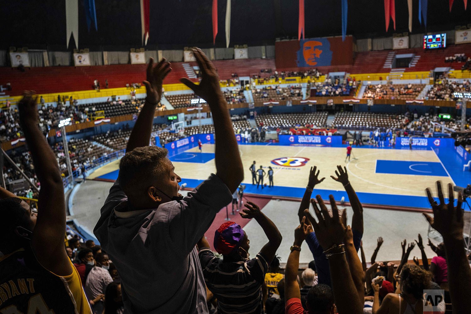  Fans do the wave during a FIBA Americas qualifier game between Cuba and Mexico for the 2023 Basketball World Cup in Havana, Cuba, Feb. 24, 2022. Mexico defeated Cuba 82 - 72. (AP Photo/Ramon Espinosa) 