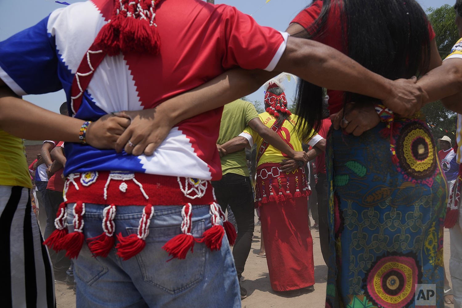  Maka Indigenous people dance during the annual celebration marking the founding of Qemkuket, a town near Puerto Falcon, Paraguay, Feb. 14, 2022. The Maka, originally from the Chaco Region, are celebrating their town's 37th anniversary. (AP Photo/Jor