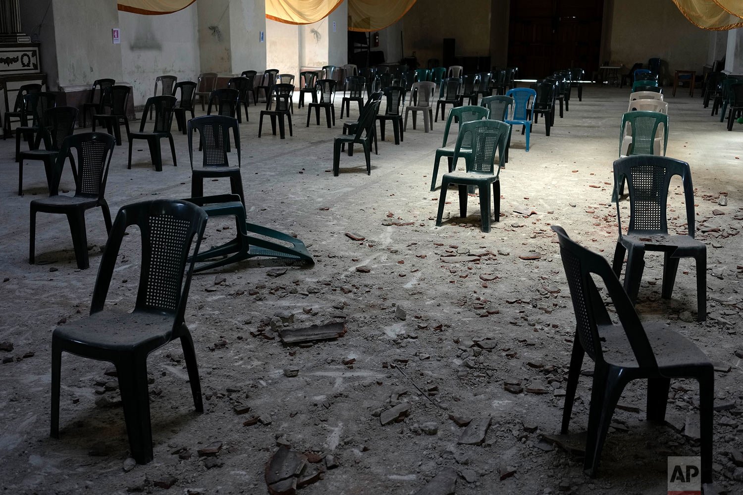  Debris blankets the floor in a partially collapsed San Juan Bautista church, triggered by an overnight 6.2-magnitude earthquake in Amatitlan, Guatemala, Feb. 16, 2022. The Guatemalan emergency agency CONRED reported structural damage in at least sev