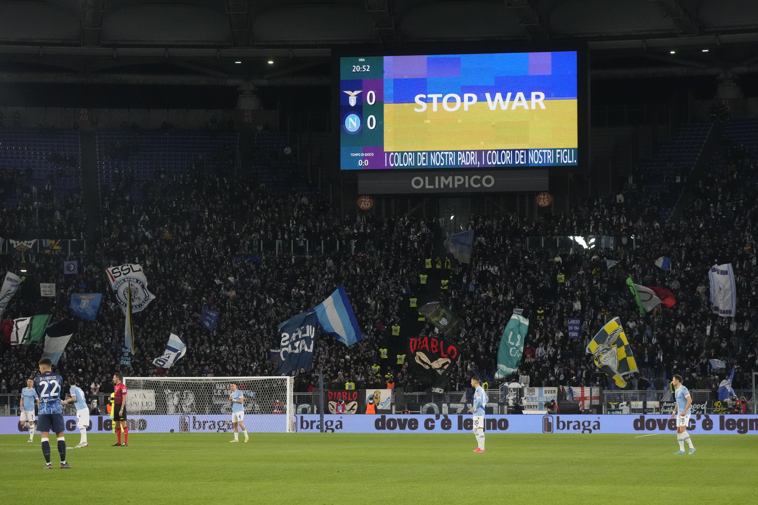  Ukraine's flag is displayed on a giant screen prior to the start of the Serie A soccer match between Lazio and Napoli at Rome's Olympic stadium, Sunday, Feb. 27, 2022. (AP Photo/Gregorio Borgia) 
