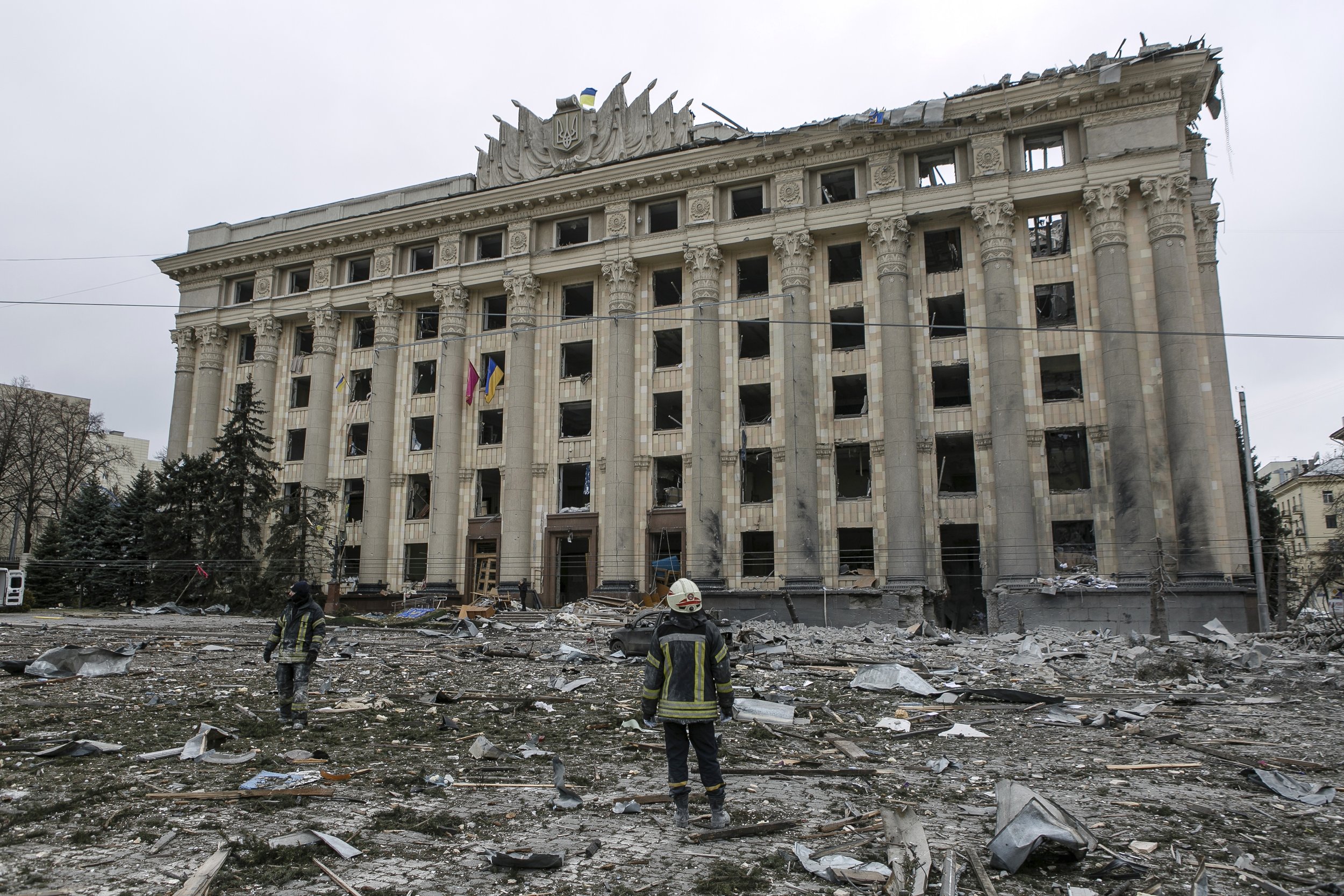  A member of the Ukrainian Emergency Service looks at the City Hall building in the central square following shelling in Kharkiv, Ukraine, Tuesday, March 1, 2022. Russian strikes pounded the central square in UkraineÕs second-largest city and other c