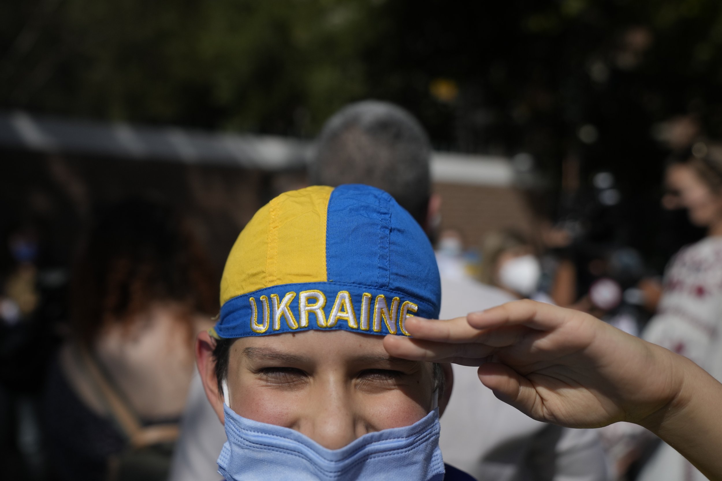  Andres Monizaga, 12, salutes during a protest against Russia's invasion of Ukraine outside the Russian embassy in Santiago, Chile, Thursday, Feb. 24, 2022. Monizaga, whose grandparents live in Ukraine, said he spent last summer with them playing che