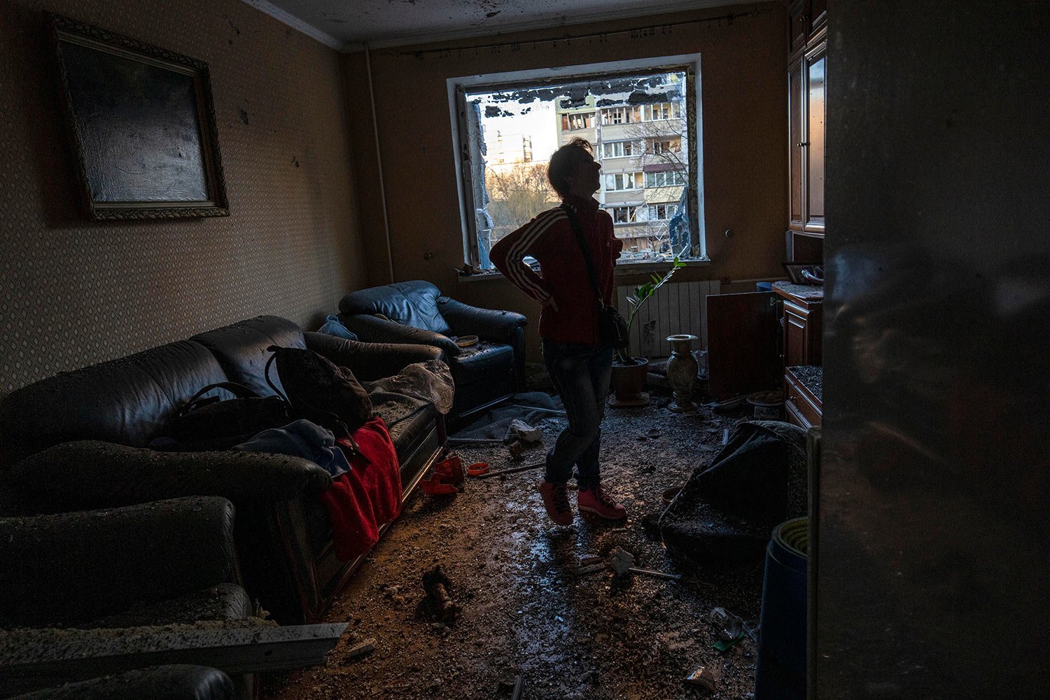  Natacha stands inside her destroyed apartment after bombing in Satoya neighborhood in Kyiv, Ukraine, Sunday, March 20, 2022. (AP Photo/Rodrigo Abd) 