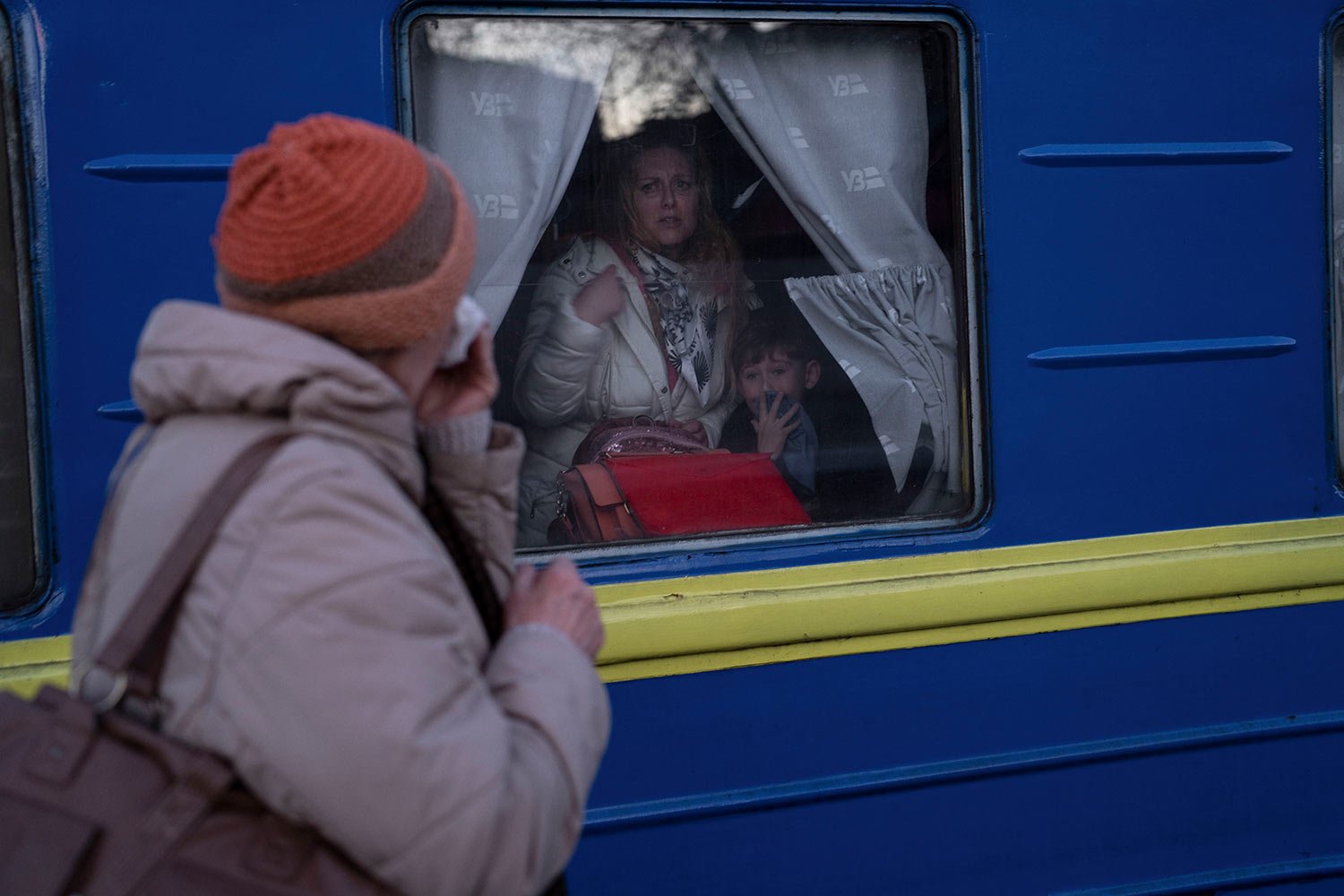  Ludmila, left, says goodbye to her granddaughter Kristina, who with her son Yaric, leave the train station in Odesa, southern Ukraine, on Tuesday, March 22, 2022. The U.N. refugee agency says more than 3.5 million people have fled Ukraine since Russ