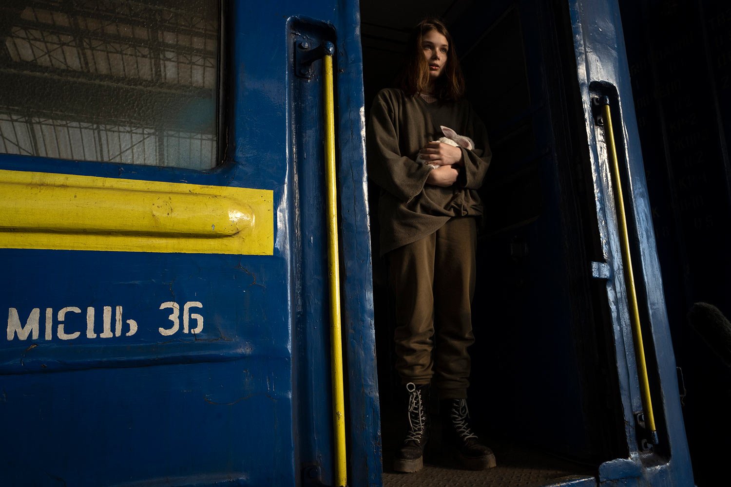  16-year-old Julia from Dnipro, who is traveling alone, holds her pet rabbit Baby after arriving to the Lviv main station, western Ukraine, Thursday, March 24, 2022. She was on her way to join her mother and then go on to Poland or Germany. (AP Photo