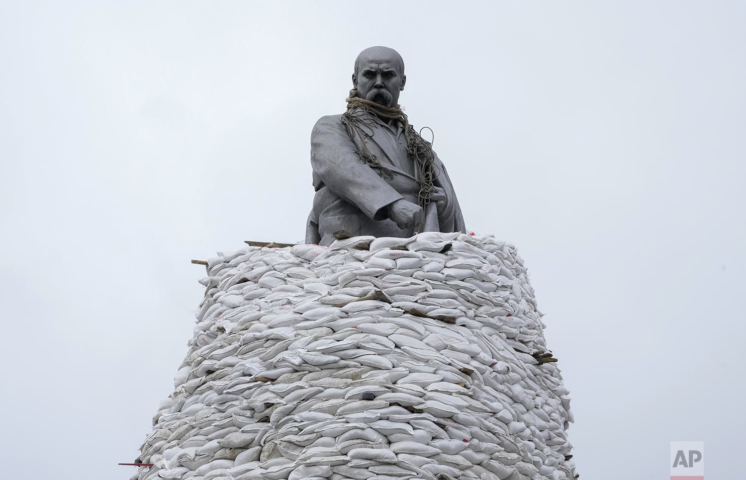  A monument of Taras Shevchenko, a famous Ukrainian poet and a national symbol, is covered with bags to protect it from the Russian shelling in Kharkiv, Ukraine, Sunday, March 27, 2022. The bronze 16 meter high monument was opened in 1935, survived W