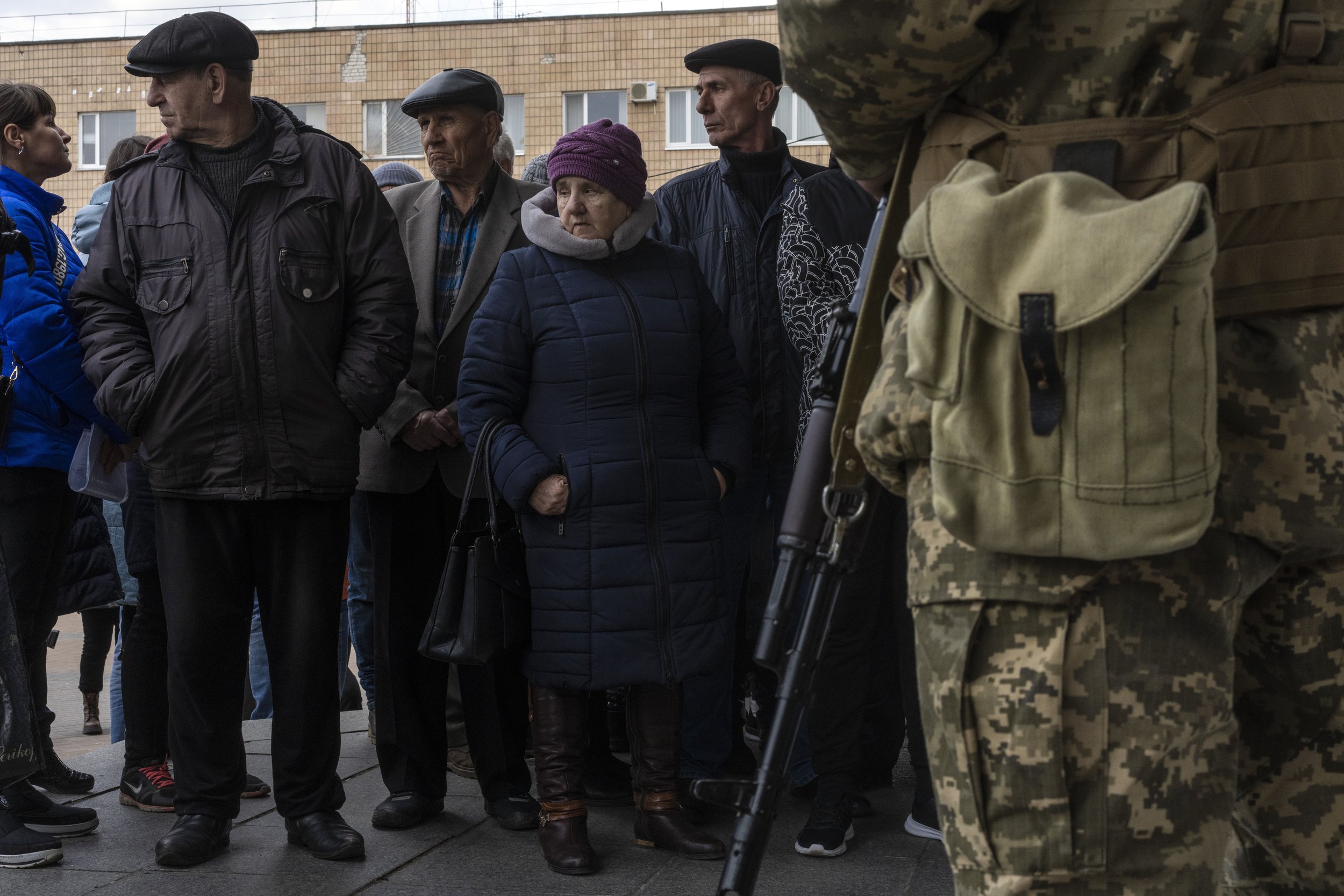  Displaced people wait in line outside the District Department of the State Migration Service to receive food and a place to sleep, in Brovary, on the outskirts of Kyiv, Ukraine, Tuesday, March 29, 2022. (AP Photo/Rodrigo Abd) 