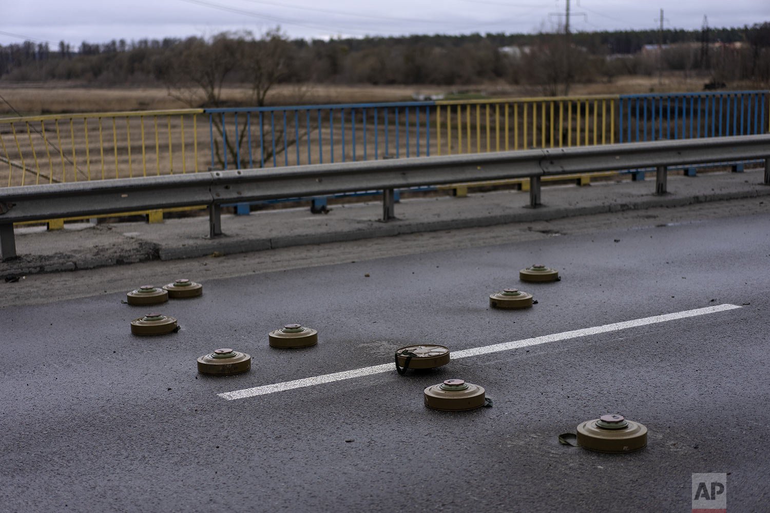  Anti-tank mines are spread out on a bridge in Bucha, on the outskirts of Kyiv, Ukraine, Saturday, April 2, 2022. (AP Photo/Rodrigo Abd) 