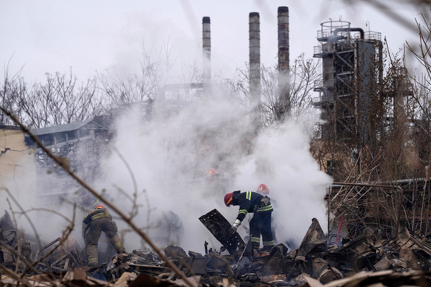  Ukrainian firefighters work at a scene of a destroyed building after shelling in Odesa, Ukraine, Sunday, April 3, 2022. (AP Photo/Petros Giannakouris) 