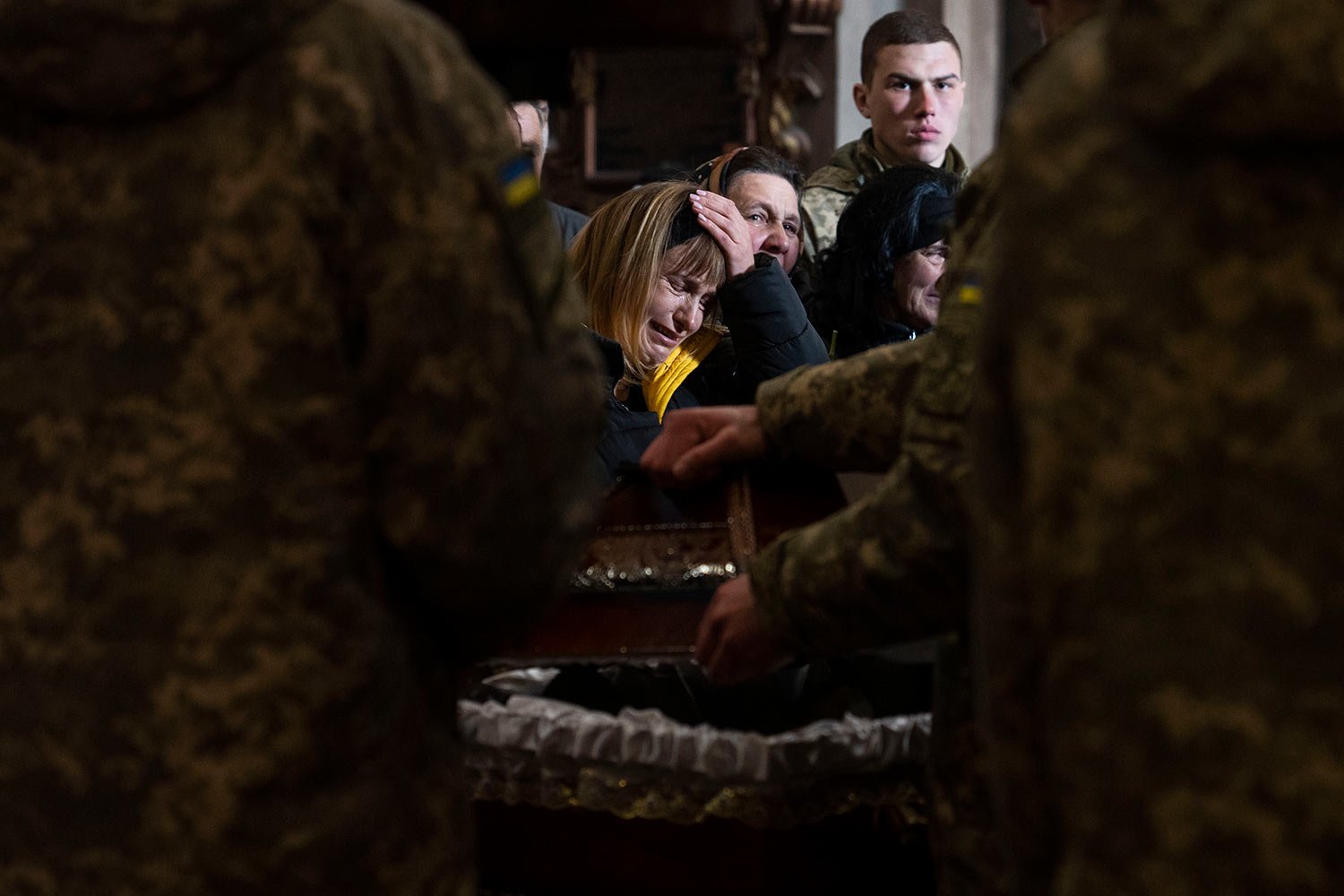  The wife of 44-year-old soldier Tereshko Volodymyr, center, reacts, during his funeral ceremony, after he died in action, at the Holy Apostles Peter and Paul Church, in Lviv, western Ukraine, Monday, April 4, 2022. (AP Photo/Nariman El-Mofty) 