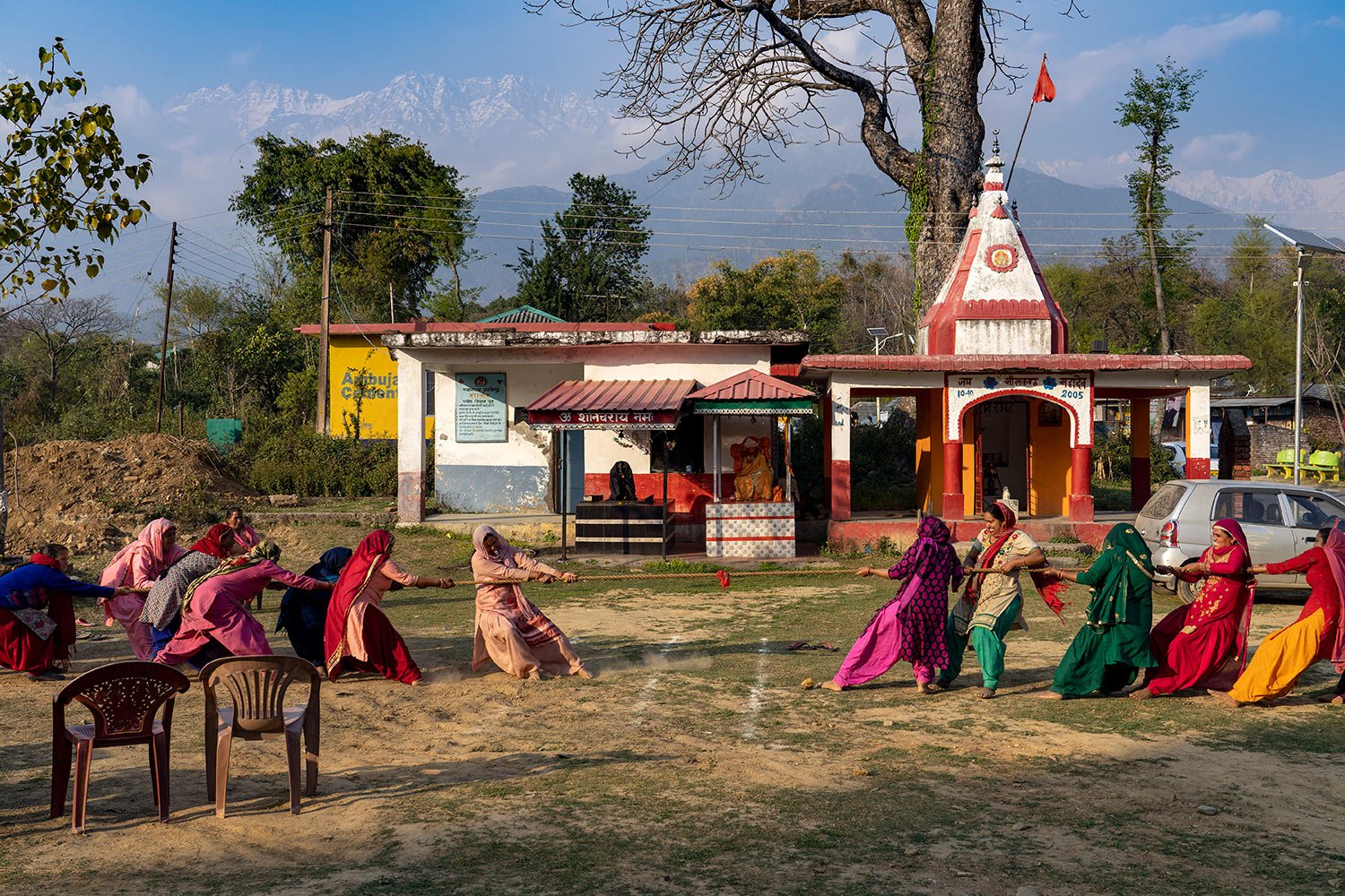  Village women compete in a tug-of-war in the compound of a Hindu temple at Hungloh village, south of Dharmsala, India, Monday, March 14, 2022. (AP Photo/Ashwini Bhatia) 