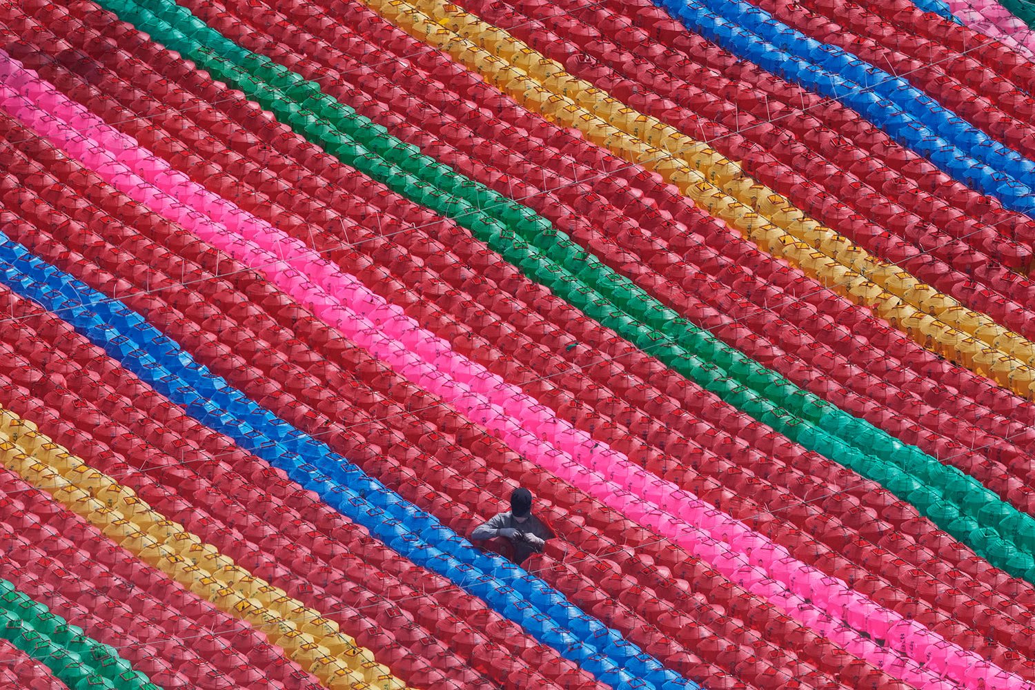  A worker checks the electric wires to hang lanterns for upcoming celebration of Buddha's birthday on May 8 at Jogye temple in Seoul, South Korea, Tuesday, March 22, 2022. (AP Photo/Ahn Young-joon) 