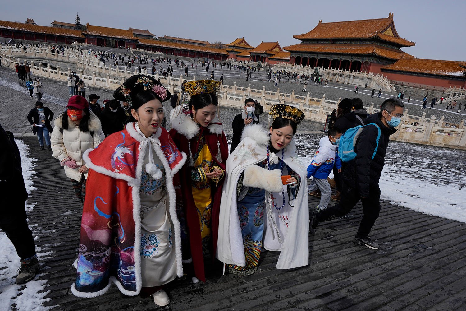  Visitors dressed in period costumes walk near the Gate of Supreme Harmony in the Forbidden City on Saturday, March 19, 2022, in Beijing. (AP Photo/Ng Han Guan) 