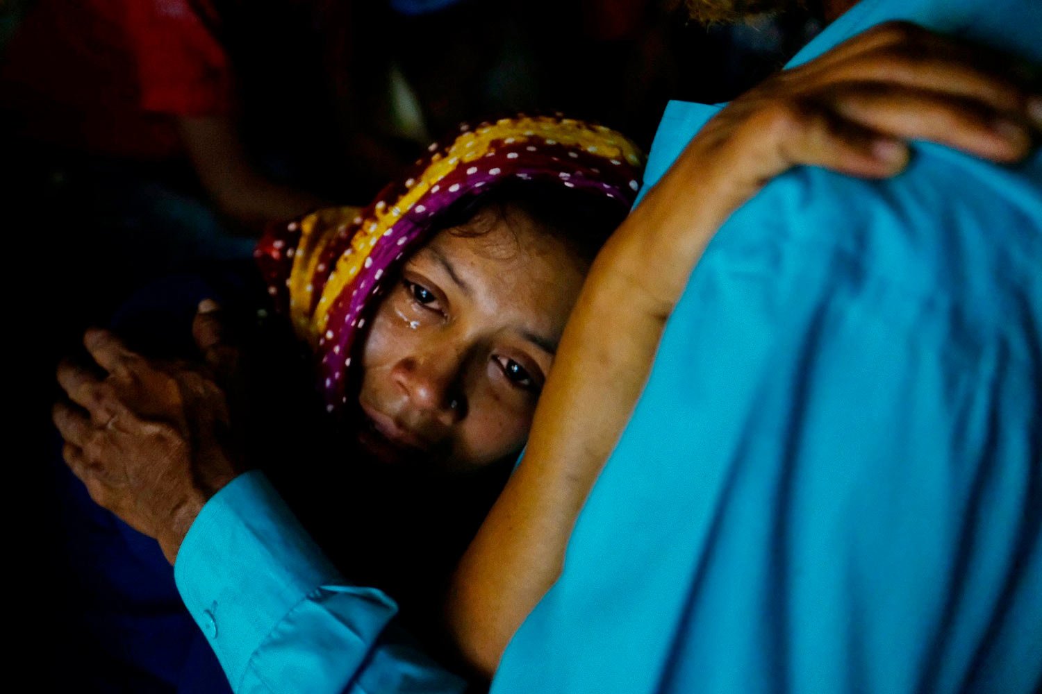  A relative mourns as rescuers try to recover bodies after a cargo vessel hit a ferry carrying dozens of people in Narayanganj, outside Dhaka, Bangladesh, Sunday, March 20, 2022. (AP Photo/Mahmud Hossain Opu) 