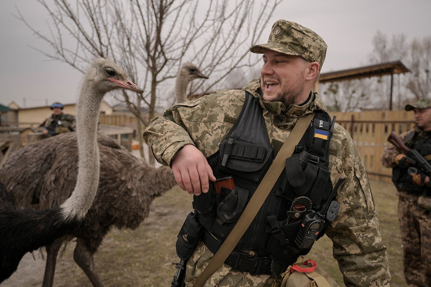  A Ukrainian serviceman tries to avoid being bitten by an ostrich at a heavily damaged private zoo as soldiers and volunteers attempted to evacuate the surviving animals to safety in the village of Yasnohorodka, on the outskirts of Kyiv, Ukraine, Wed