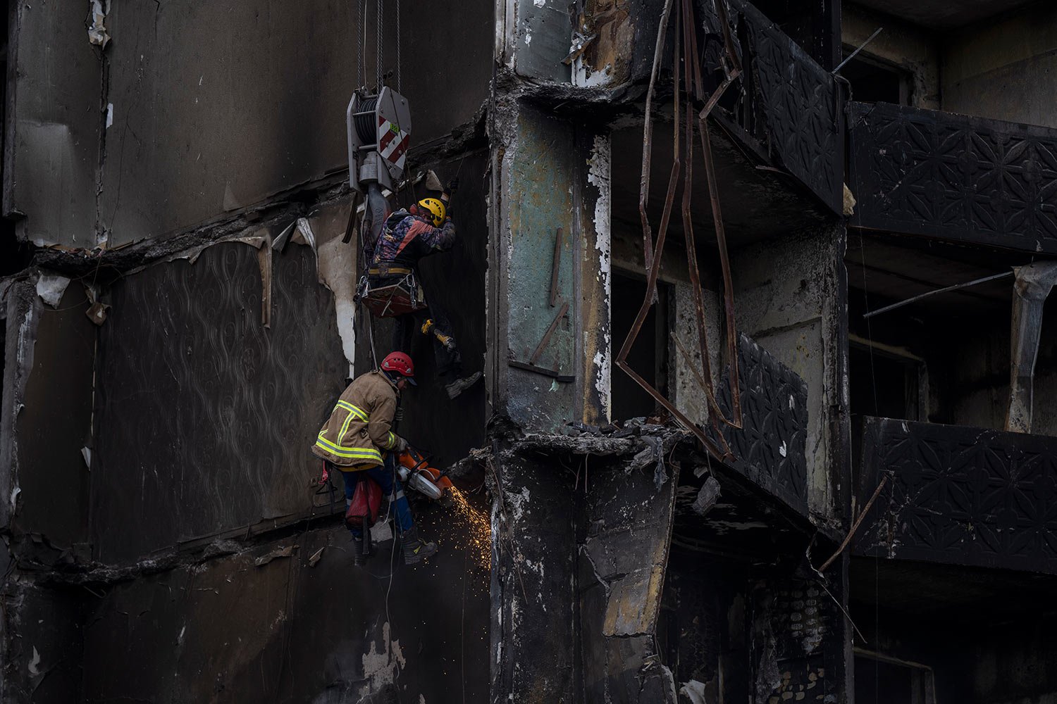  Firefighters work on a  destroyed apartment building in the town of  Borodyanka, Ukraine, on Saturday, April  9, 2022. (AP Photo/Petros Giannakouris) 