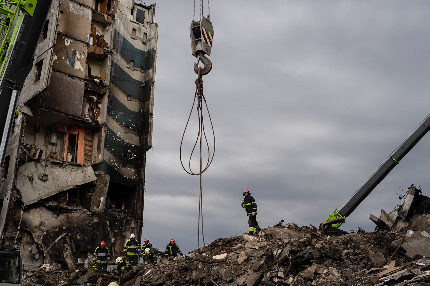 Firefighters work on a destroyed apartment building in the town of  Borodyanka, Ukraine, on Saturday, April  9, 2022.  (AP Photo/Petros Giannakouris) 