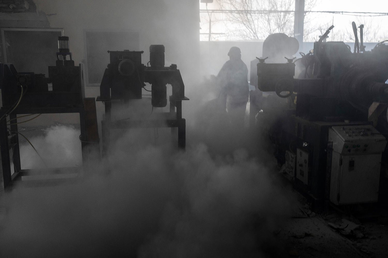 Firefighters try to extinguish the fire at a damaged factory following a Russian bombing in Kramatorsk, Ukraine, Thursday, April 14, 2022. (AP Photo/Petros Giannakouris) 