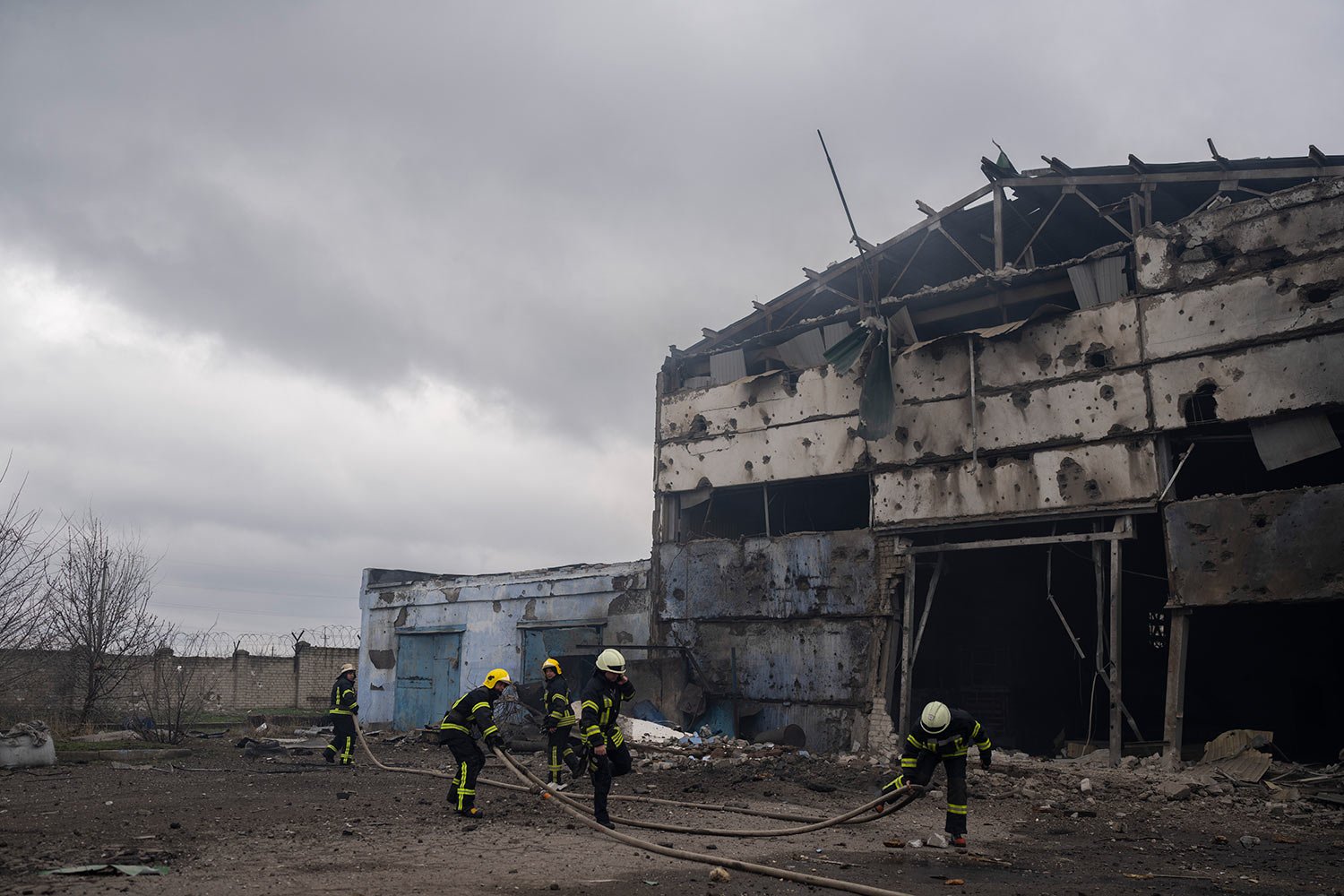  Firefighters try to extinguish the fire at a damaged factory following a Russian bombing in Kramatorsk, Ukraine, Thursday, April 14, 2022. (AP Photo/Petros Giannakouris) 