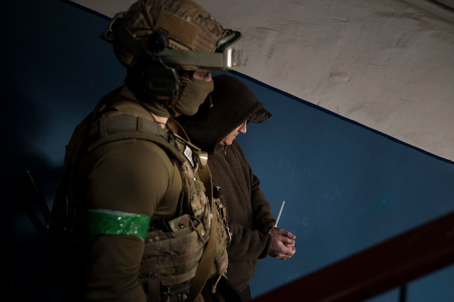  A Security Service of Ukraine (SBU) serviceman detains a man suspected to be a Russian collaborator in Kharkiv, Ukraine, Thursday, April 14, 2022. (AP Photo/Felipe Dana) 