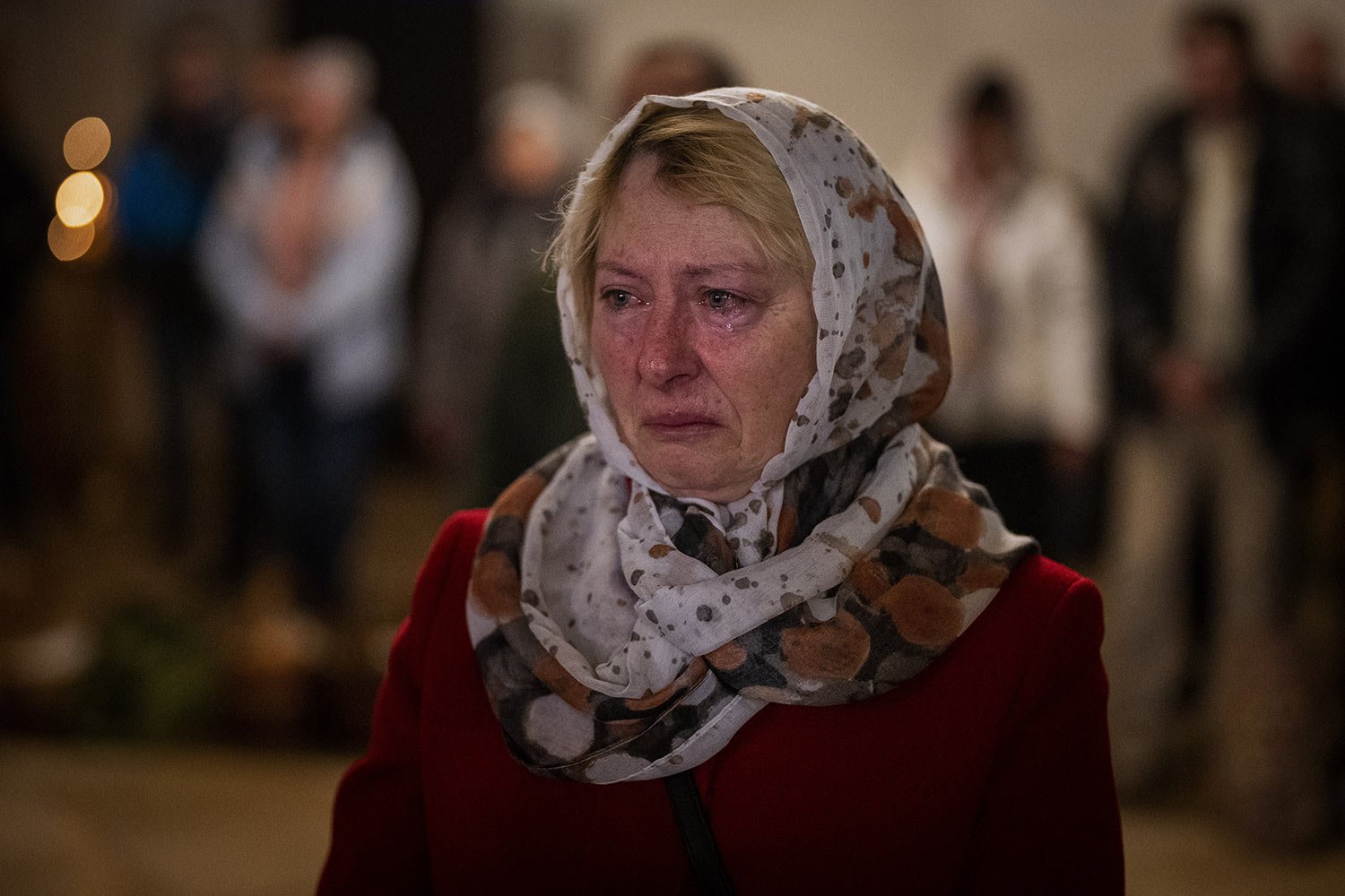  Olga Zhovtobrukh, 55, cries during an Easter service at a church in Bucha on the outskirts of Kyiv, on Sunday, April 24, 2022. (AP Photo/Emilio Morenatti) 