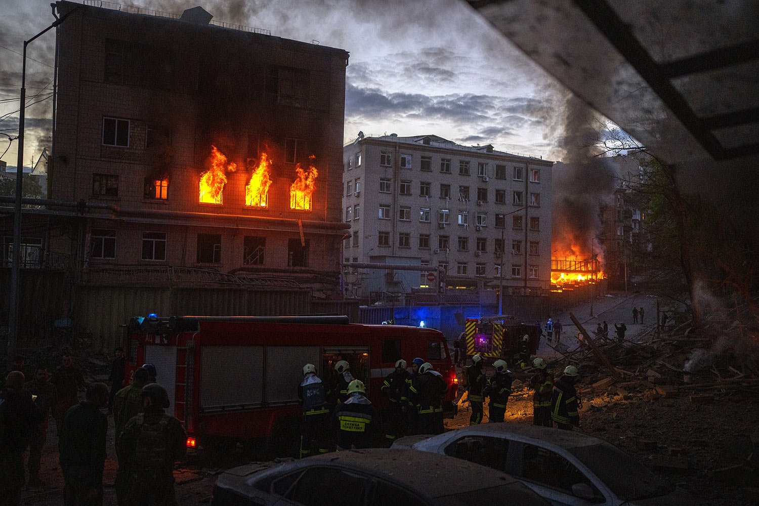  Emergency services work at the site where fires were triggered by an explosion in Kyiv, Ukraine, Thursday, April 28, 2022. Russia struck the Ukrainian capital of Kyiv shortly after a meeting between President Volodymyr Zelenskyy and U.N. Secretary-G