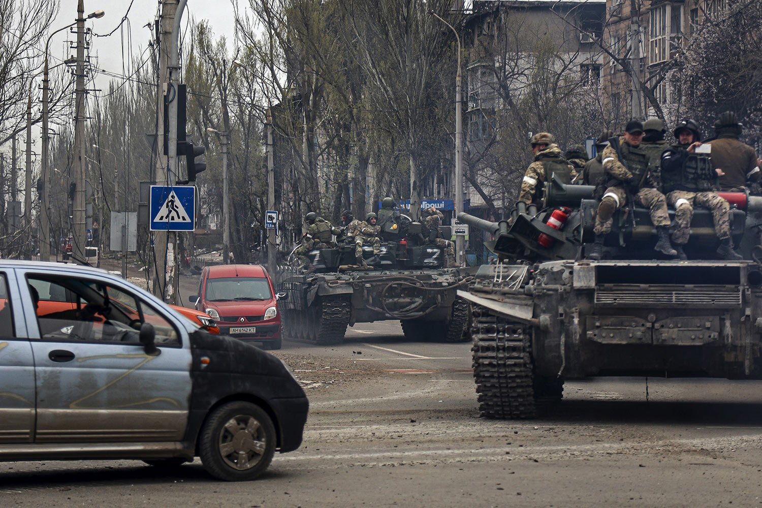  Russian tanks roll along a street in an area controlled by Russian-backed separatist forces in Mariupol, Ukraine, Saturday, April 23, 2022. (AP Photo/Alexei Alexandrov) 