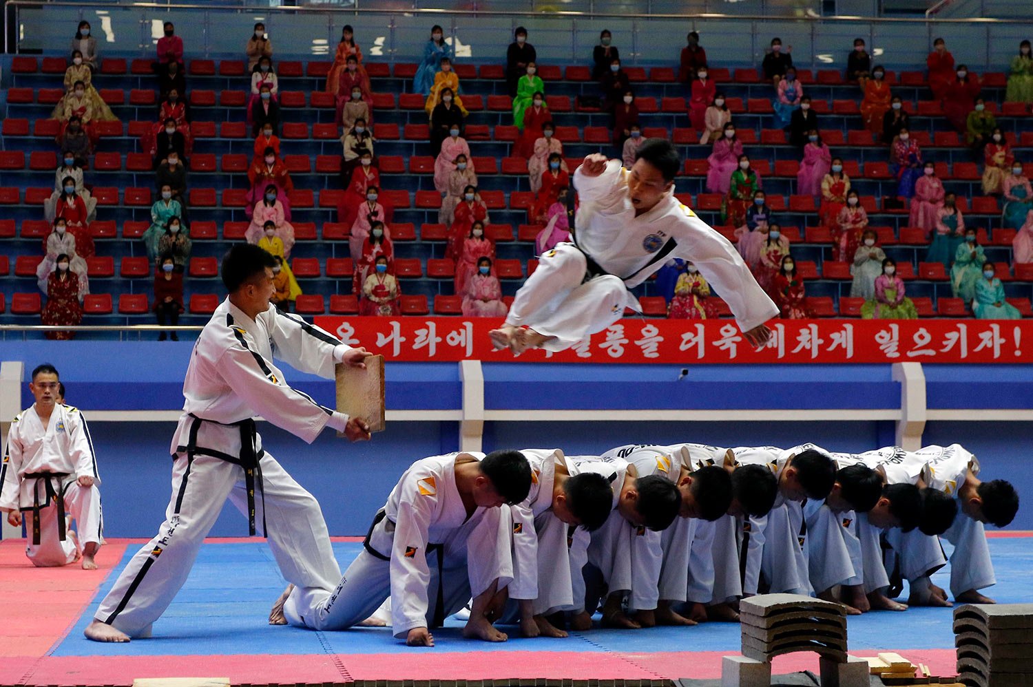  Players of the Taekwon-Do Team of the Korean Taekwon-Do Committee show a demonstration after the opening ceremony of Mangyongdae Prize National Martial Art Championship to mark the birth anniversary of former North Korean leader President Kim Il Sun