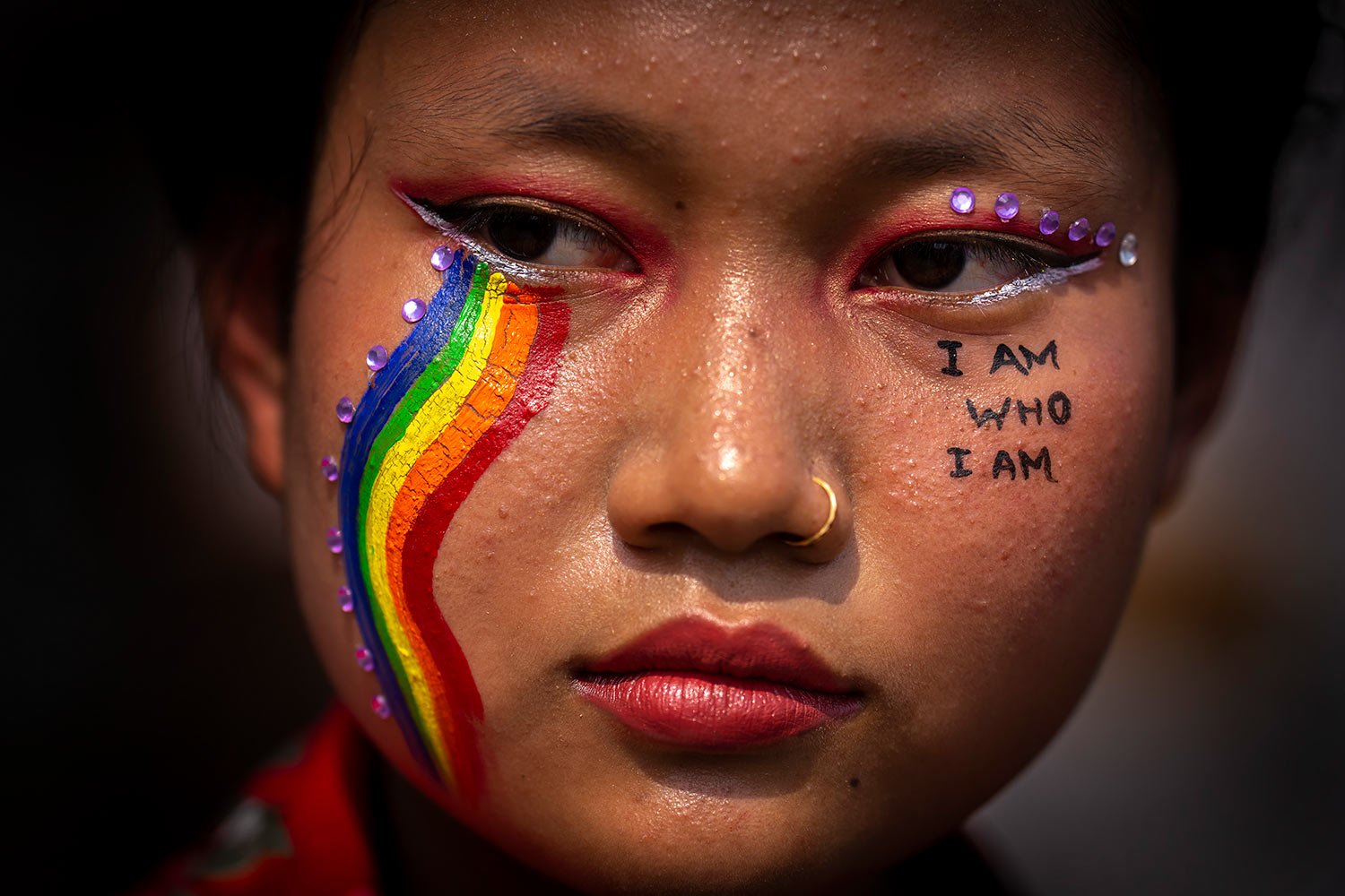  A participant has rainbow colors painted on the face during a queer pride walk in Gauhati, India, Sunday, April 24, 2022. (AP Photo/Anupam Nath) 