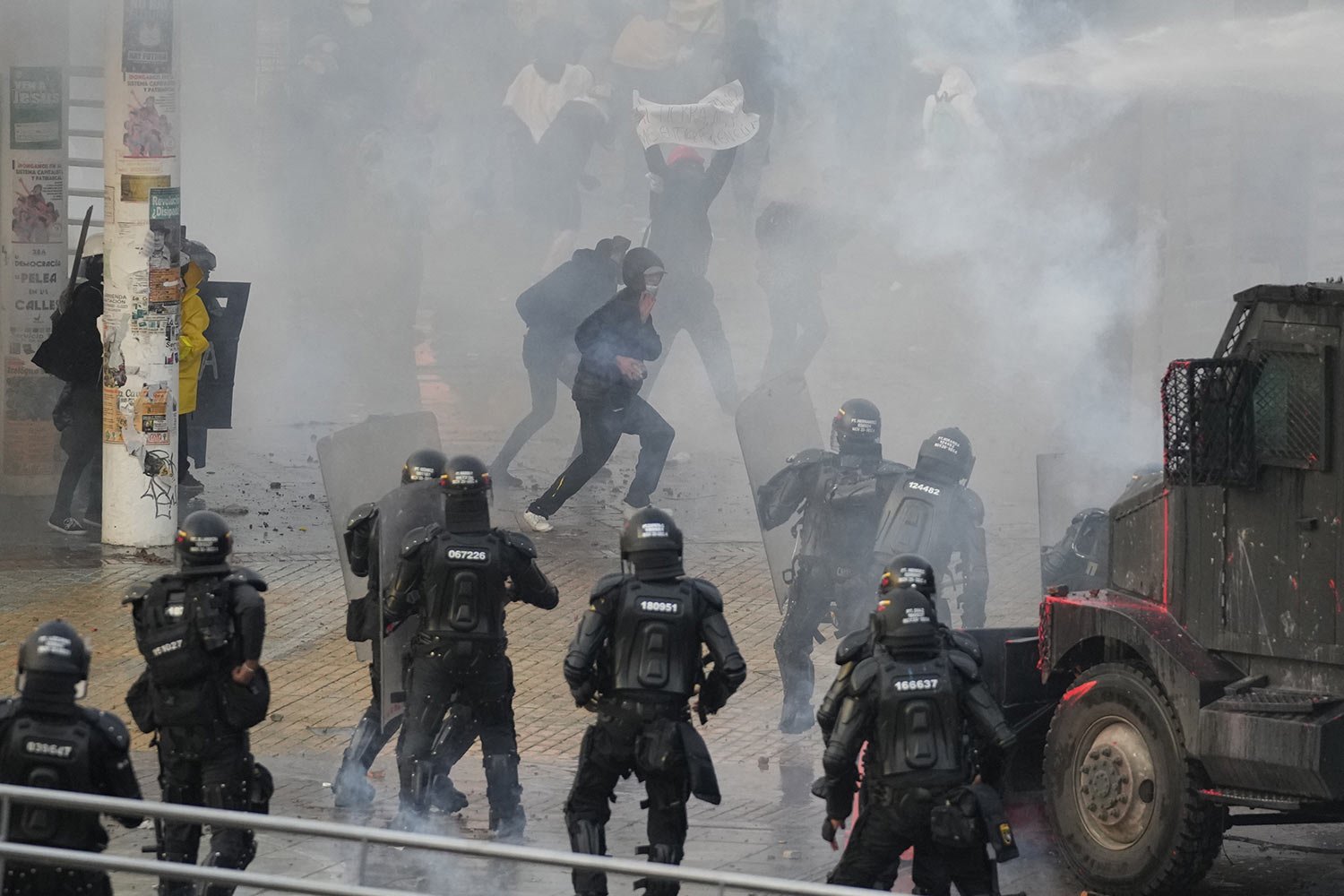  University students and police clash after an event commemorating the previous year's strike against a government-proposed tax reform that turned violent in Bogota, Colombia, April 28, 2022. (AP Photo/Fernando Vergara) 