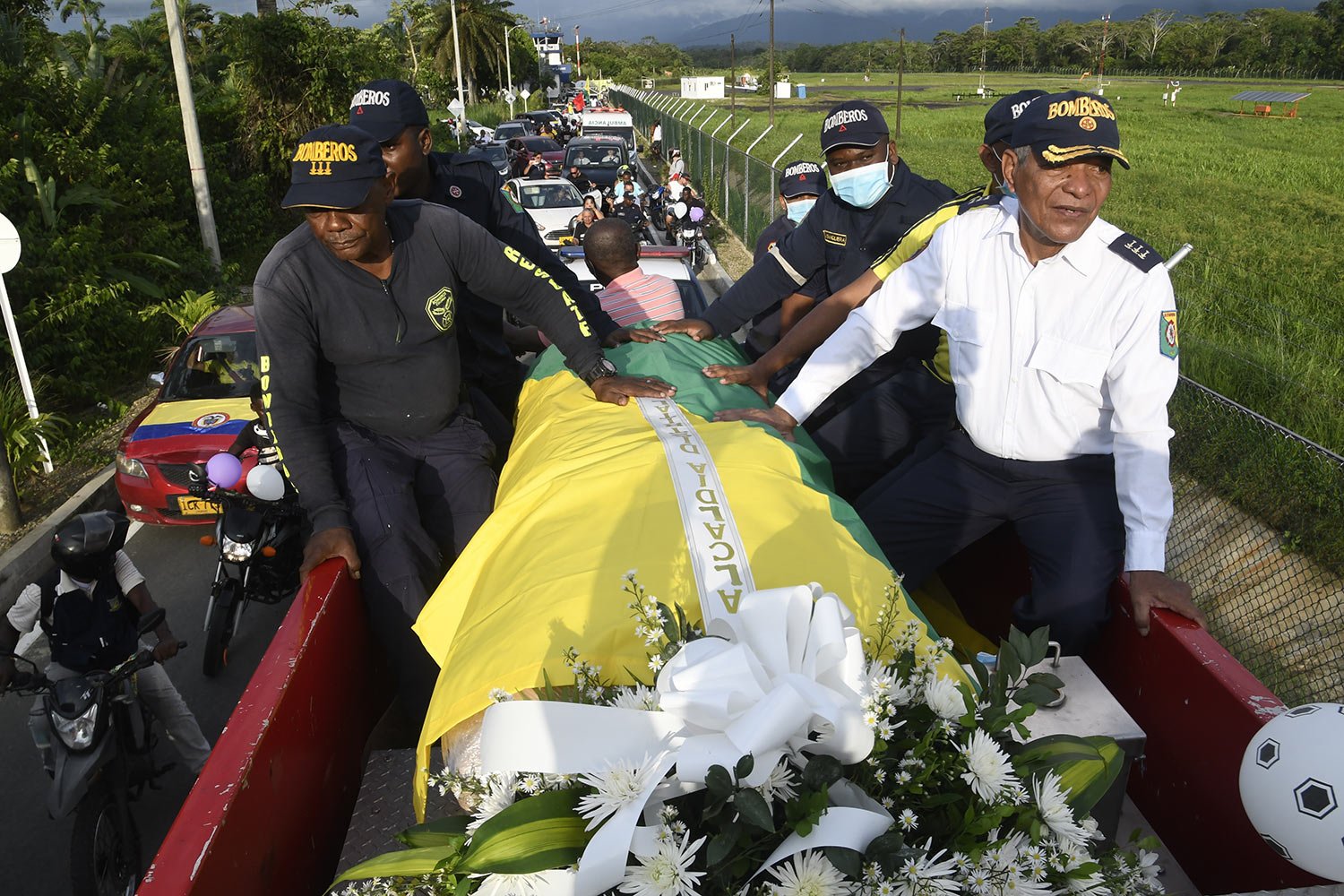  The remains of former Colombian soccer star Freddy Rincon is transported on a fire truck from the city’s airport to the sports coliseum after arriving to his native Buenaventura, Colombia, April 14, 2022. Rincon, a former captain of the Colombian na