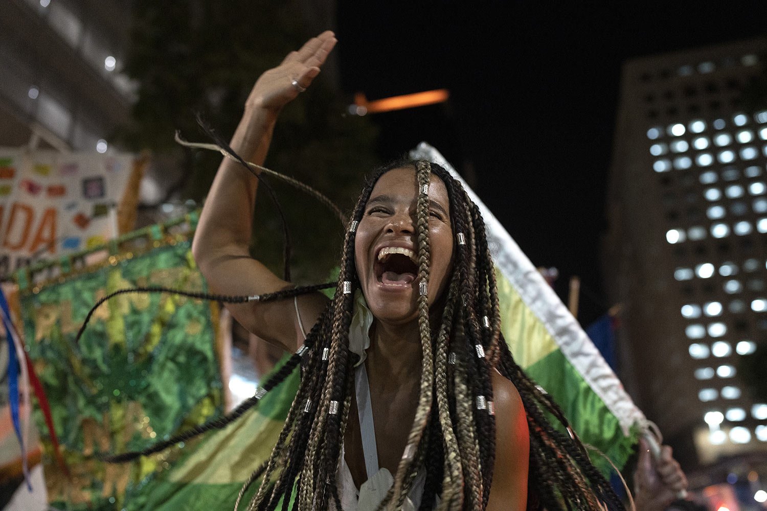  A Carnival reveler dances at a street party, or “bloco,” as part of a protest against Carnival restrictions by city officials in Rio de Janeiro, Brazil, April 13, 2022. City Hall banned Carnival street parties  due to the pandemic. (AP Photo/Silvia 