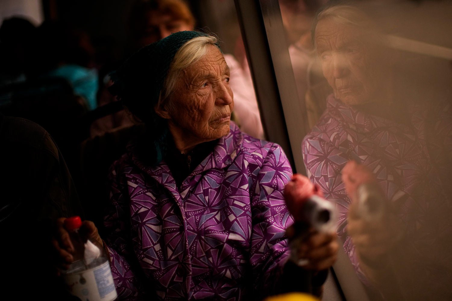  Kateryna Hodza, 85, takes a bus from a reception center for displaced people in Zaporizhzhia, Ukraine, Friday, April 29, 2022. They fled from Mala Tokmachka, in Zaporizhzhia region, as thousands of Ukrainian continue to leave Russian occupied areas.