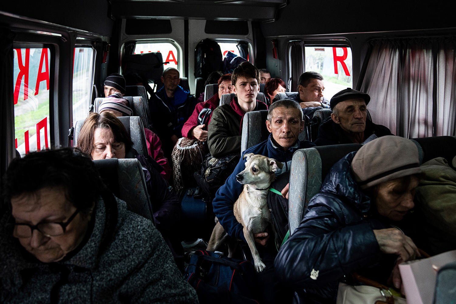  People sit in a bus during evacuation from Lyman, Donetsk region, eastern Ukraine, Saturday, April 30, 2022. (AP Photo/Evgeniy Maloletka) 