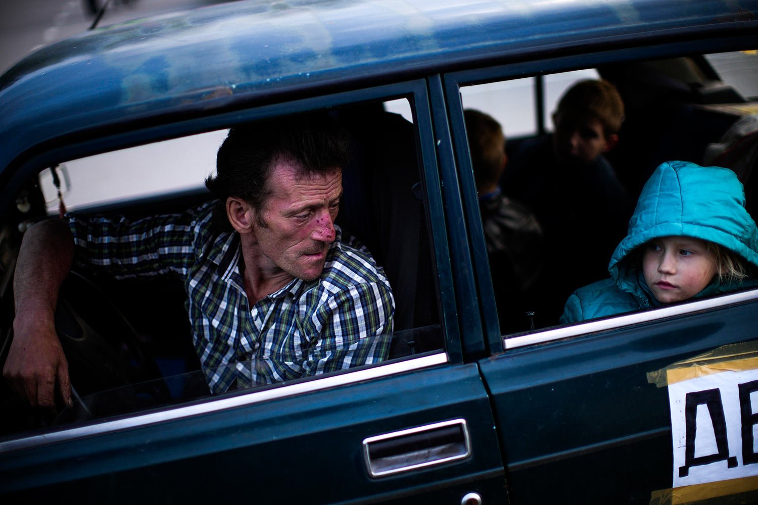  A man looks at his daughter as they arrive to a reception center for displaced people in Zaporizhzhia, Ukraine, Monday, May 2, 2022. Thousands of Ukrainians continue to leave Russian occupied areas. (AP Photo/Francisco Seco) 