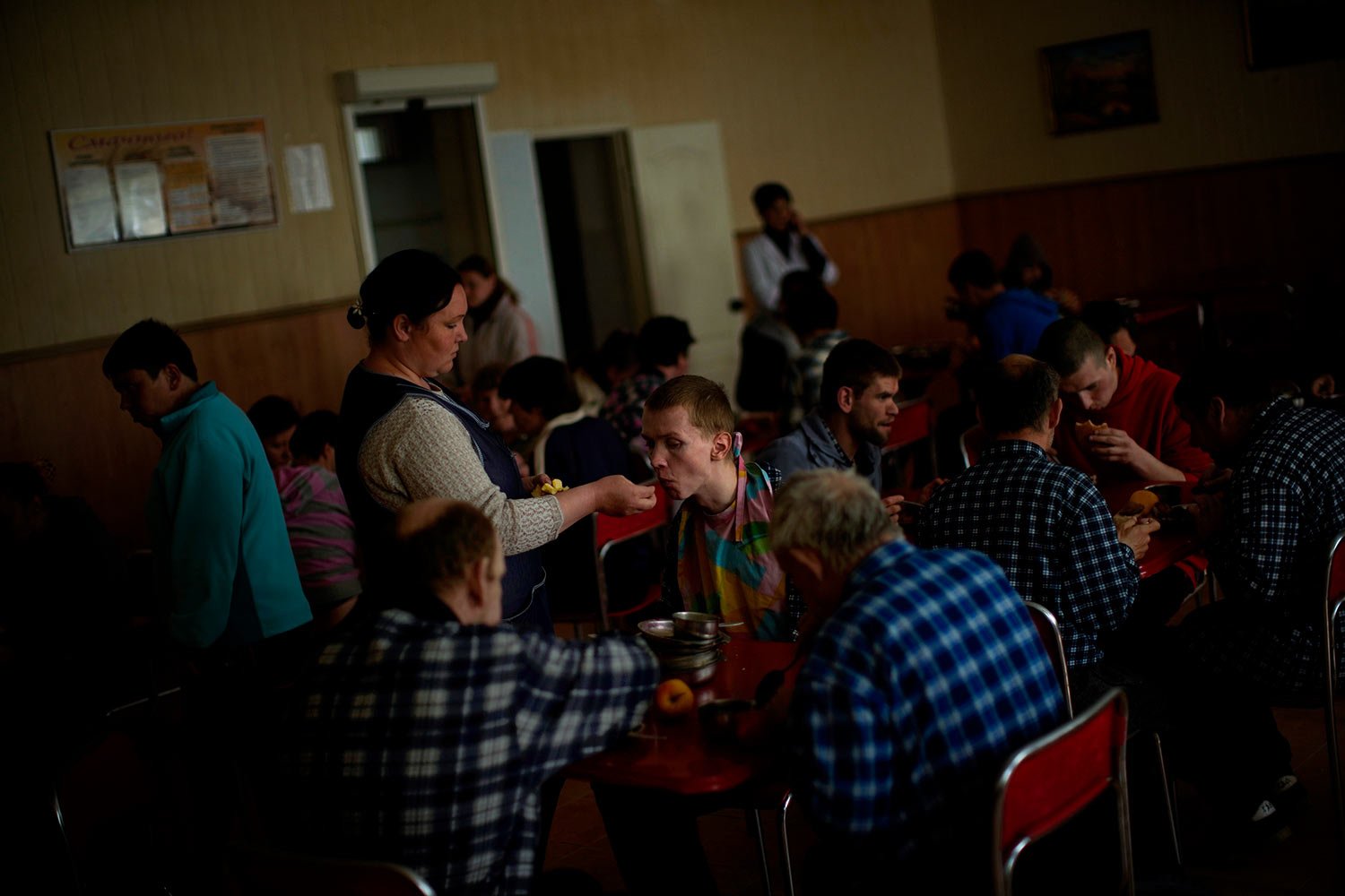  Residents have their lunch in a facility for people with mental and physical disabilities in the village of Tavriiske, Ukraine, Tuesday, May 10, 2022. With around 425 residents, the institution is the largest such facility for people with disabiliti