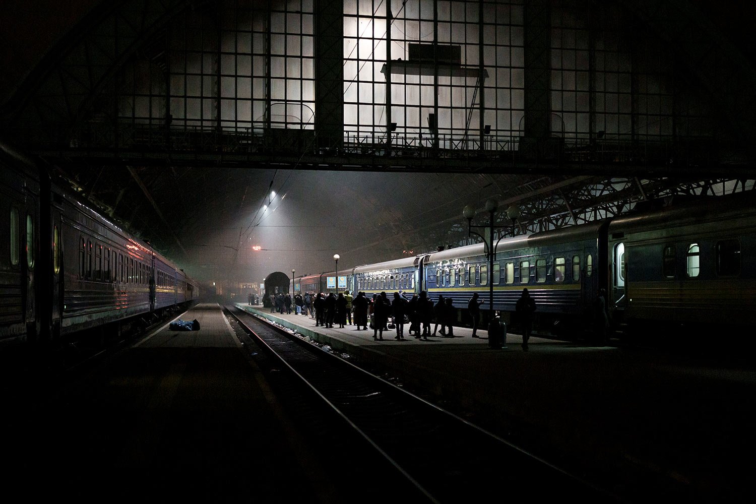  People trying to flee Ukraine wait for trains inside Lviv railway station in Lviv, western Ukraine, Friday, March 4, 2022. (AP Photo/Felipe Dana)  