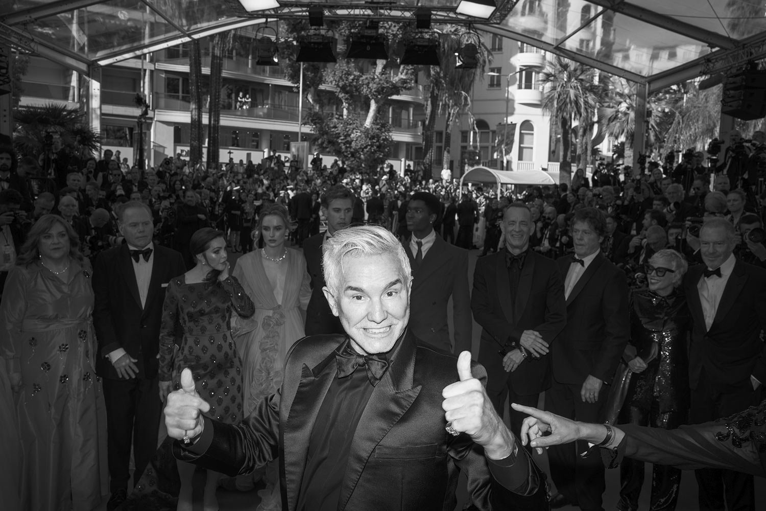  Director Baz Luhrmann flashes two thumbs up as he poses for photographers upon arrival at the premiere of the film 'Elvis' at the 75th international film festival, Cannes, southern France, Wednesday, May 25, 2022. (AP Photo/Petros Giannakouris) 
