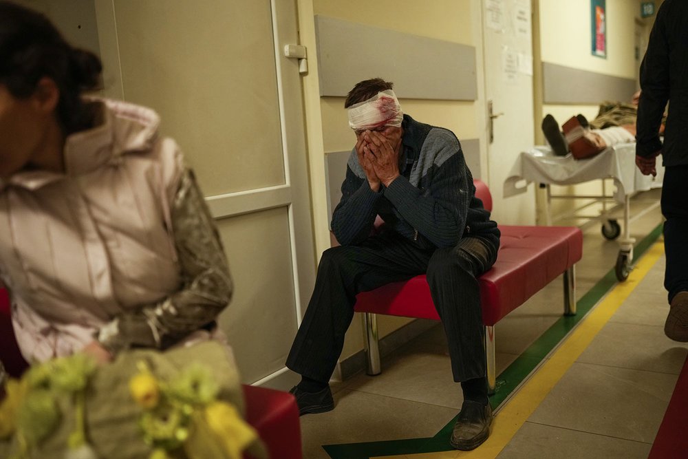  A resident injured in a Russian strike sits at a hospital in Pokrovsk, eastern Ukraine, Wednesday, May 25, 2022, on the day two rockets struck the eastern Ukrainian town in the Donetsk region. (AP Photo/Francisco Seco) 