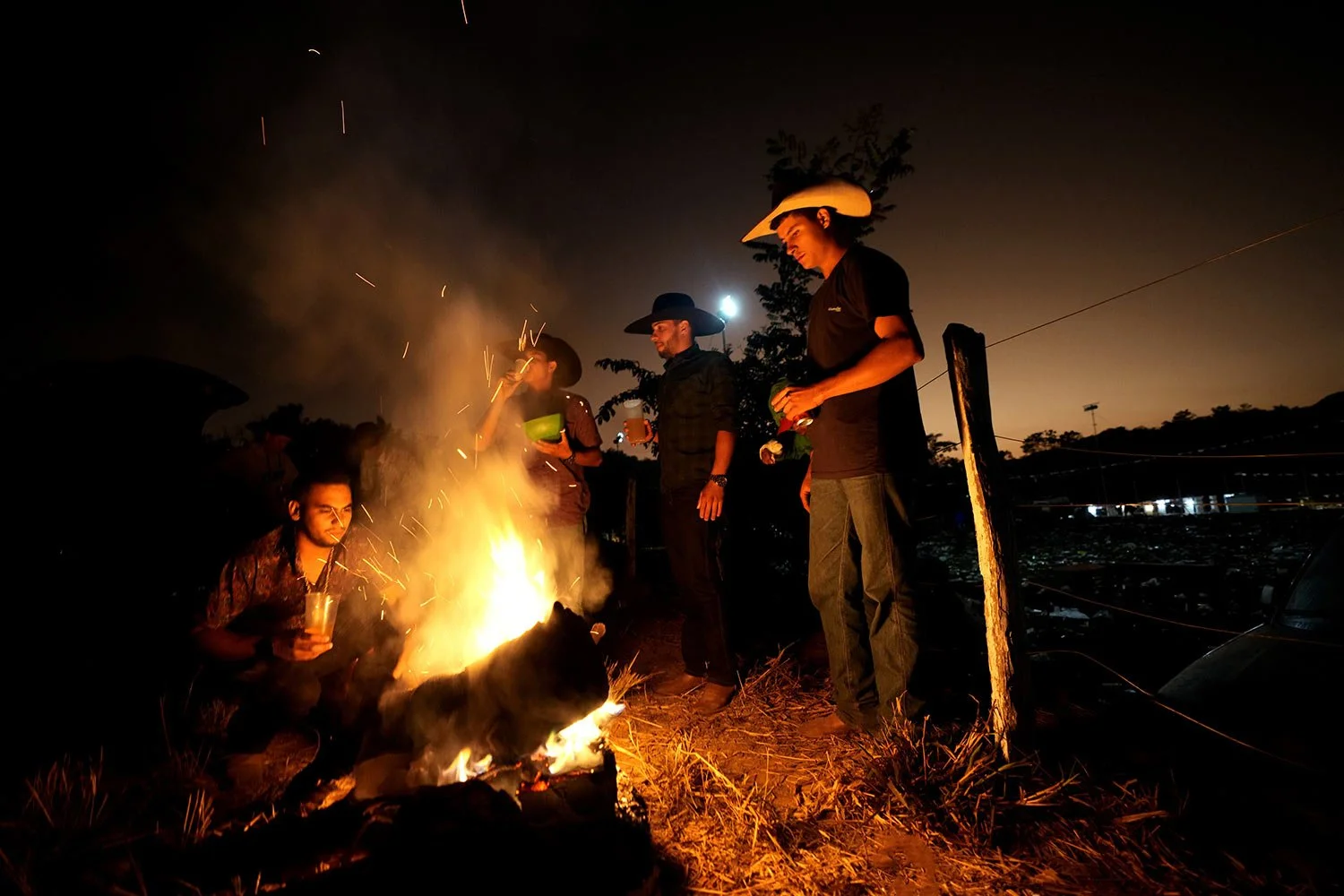  Revelers gather by a bonfire after the grand dance at the Feast of the Divine, in Pirenopolis, Goias state, Brazil, May 29, 2022. (AP Photo/Eraldo Peres) 