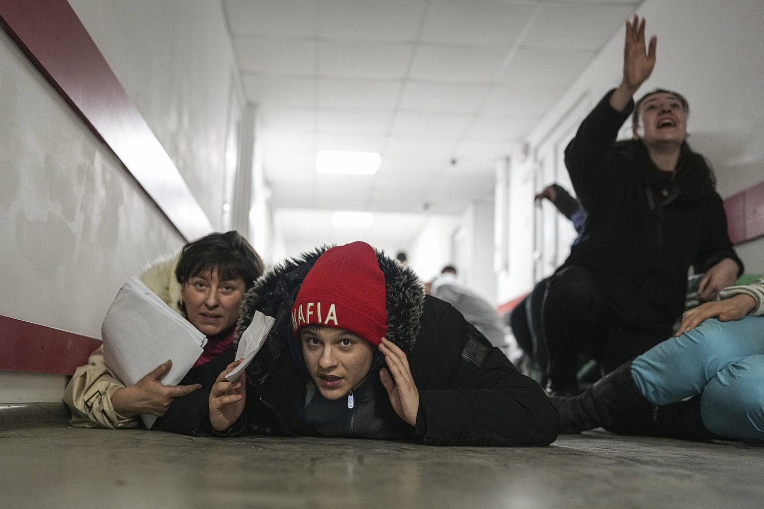 People take cover on the floor of a hospital during shelling by Russian forces in Mariupol, Ukraine, Friday, March 4, 2022. (AP Photo/Evgeniy Maloletka) 