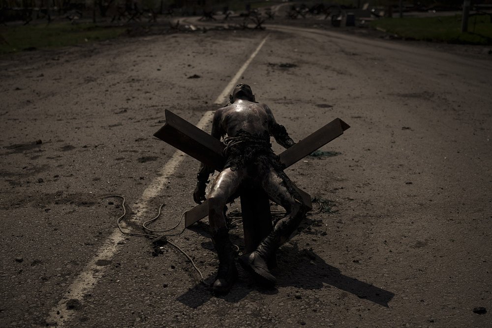  GRAPHIC CONTENT - The body of an unidentified man lies on a road barrier near a village retaken by Ukrainian forces on the outskirts of Kharkiv, Ukraine, Saturday, April 30, 2022. (AP Photo/Felipe Dana) 