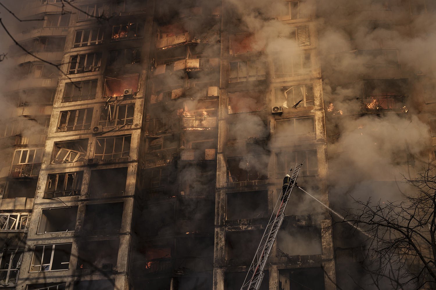  Ukrainian firefighters work at a bombed apartment building in Kyiv, Ukraine, Tuesday, March 15, 2022. (AP Photo/Felipe Dana) 