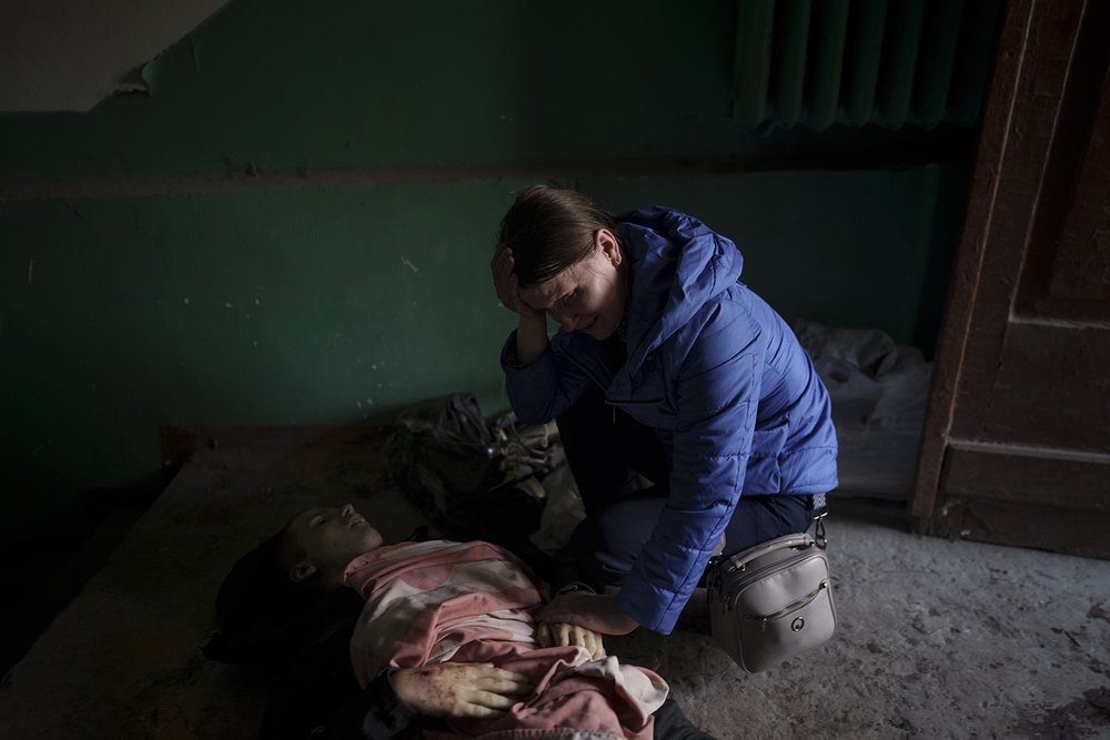  EDS NOTE: GRAPHIC CONTENT - Nina Shevchenko mourns over the body of her 15-year-old son Artem Shevchenko, who was killed in a Russian attack on Kharkiv, Ukraine, Friday, April 15, 2022. (AP Photo/Felipe Dana) 