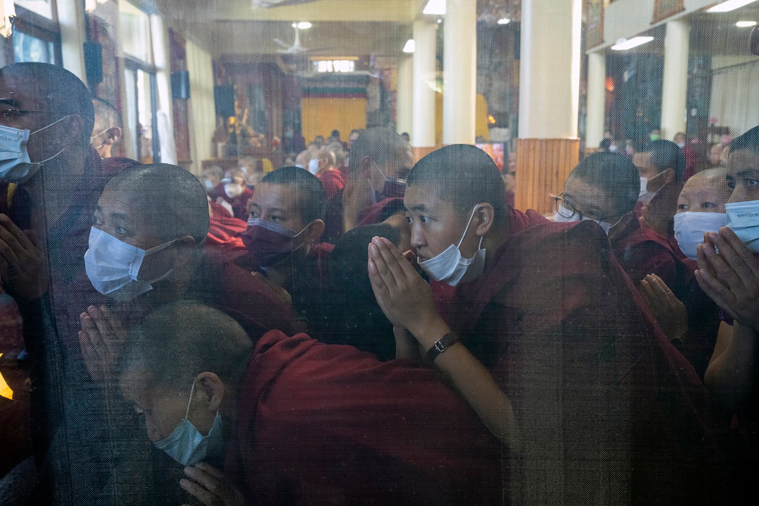  Exile Tibetan Buddhist monks and nuns greet their spiritual leader the Dalai Lama as he arrives to attend a a prayer session in Dharmsala, India, Wednesday, May 25, 2022.  (AP Photo/Ashwini Bhatia) 