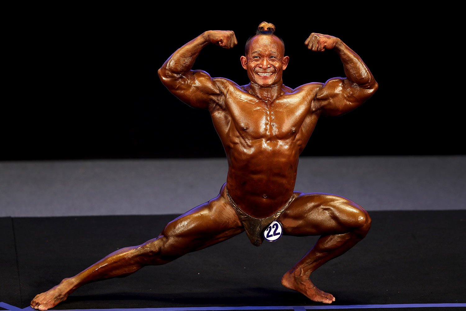  Mg Mg Myint of Myanmar compete in Men's Bodybuilding 65kg during the 31st Southeast Asian Games (SEA Games 31) in Hanoi, Vietnam Friday, May 13, 2022.  (AP Photo/Minh Hoang) 